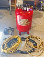 Compressor with hoses and pneumatic tools