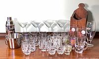 Full group of glassware, shaker, ice bucket, wooden caddy