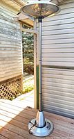 Full view of freestanding electric patio heater on deck