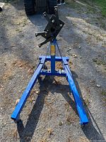 Full view of blue Power Fist folding engine stand assembled