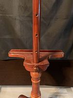 Close-up of center column showing adjustment holes and finish