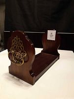 Perspective view showing one end panel, brass handle and overall finish