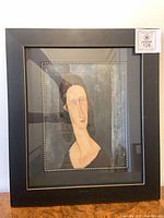 Front view of framed print in black frame