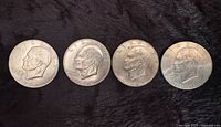 Obverse of four Eisenhower dollars dated 1971, 1972, 1974, 1776-1976