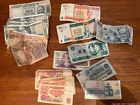 Group view of all assorted banknotes spread on table