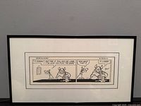 Full view of framed comic strip with mat and frame