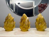 Front view of the three matching flame carnival glass shades