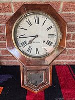Front view of Seth Thomas wall clock showing dial and case