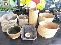 Group shot of all seven wicker baskets in various shapes and sizes