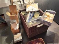 Overview of basket with candles, boxes, coasters