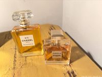 Both Chanel perfume bottles on table