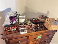 Overview of dresser top with entire jewelry lot