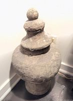 Full view of urn showing lid, body, pedestal base