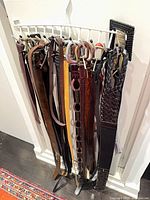 Rack holding approx. 15 assorted belts