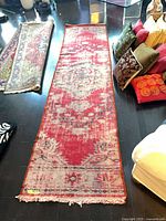 Full view of carpet runner showing length and fringe ends