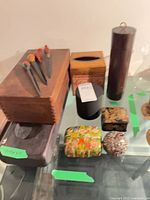 Group shot of trinket boxes, tissue box, cylindrical container and candle stand