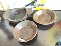 Three wood bowls on floor