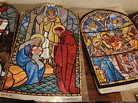 Close-up of two arched prints showing nativity and presentation scenes, numbered and marked Printed in England