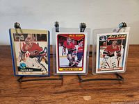 Front view of three Patrick Roy hockey cards on stands