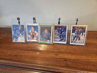 Front view of all five rookie cards in cases