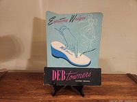 Front view of entire Deb Towners cardboard sign on stand