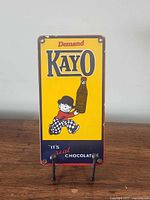 Front view of Kayo porcelain sign showing full graphic and text