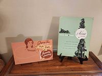 Gypsy Tea cardboard sign and Accent shoes folder displayed on easels