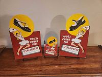 Three Teenlanders cardboard signs front view