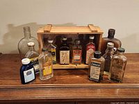Group shot of all bottles and wood crate on table