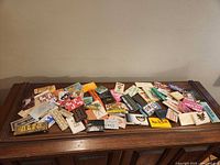 Overview of all rolling-paper booklets spread on wooden surface