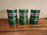 Front view of three Essolube HDX cans