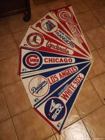 All six pennant banners spread on floor showing team names and logos