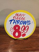 Front view of round Honest Ed's sign