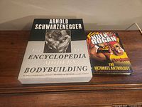 Book and DVD set side by side on wooden surface