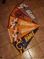 All five NFL felt pennants overlapped on floor