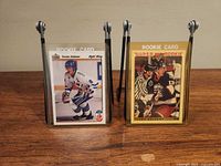 Both Teemu Selanne rookie trading cards in holders, front view