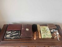 All grooming items, brushes, onyx box and watches displayed