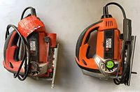 Two Black & Decker corded jigsaws side by side