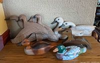 Group shot of all seven duck figures on tabletop