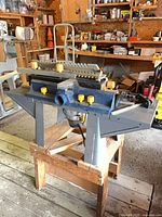 Router table mounted on stand showing overall setup