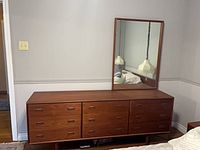 Front view of teak dresser with mirror attached