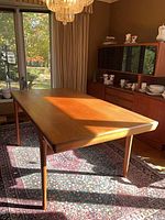 Full view of teak dining table in dining room