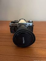 Front view of Canon AE-1 with Maginon lens and cap