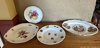 Group shot of all four German porcelain plates