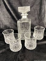 decanter with four glasses front view