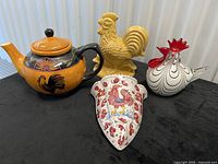 Group shot showing four rooster-themed items