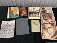 Group shot of all nine vintage books and magazines