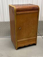 Front view of wooden waterfall side table with door closed