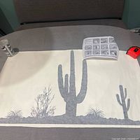 Full view of decal sheet with tube, instruction sheet, and tape measure for scale