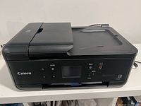 Front view of Canon Pixma TR7520 showing control panel and output tray